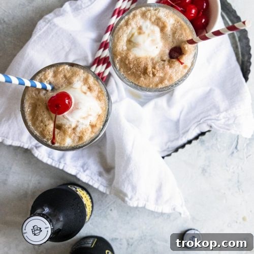 A close-up image of a root beer float with a cherry on top, representing the finished recipe.