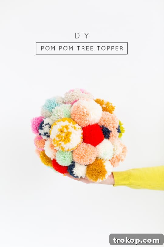 Martha Stewart's Holiday Crafting: Signature Tree Toppers & DIY Ornaments 14 Materials laid out for making a DIY pom pom tree topper: styrofoam sphere, yarn, and glue gun