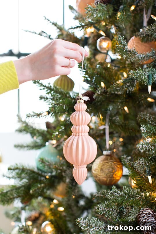 Martha Stewart's Holiday Crafting: Signature Tree Toppers & DIY Ornaments 17 Finished pom pom DIY tree topper ready for placement on a Christmas tree