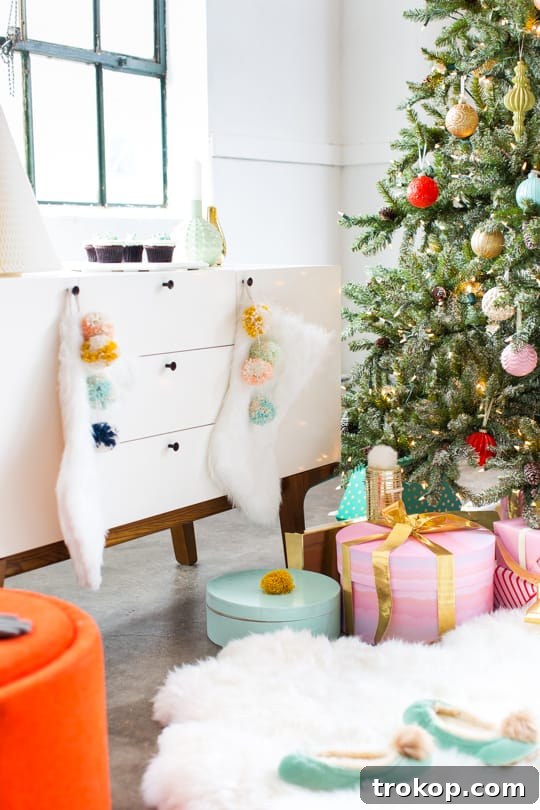 Martha Stewart's Holiday Crafting: Signature Tree Toppers & DIY Ornaments 18 A grand Martha Stewart Snowy Fir artificial Christmas tree decorated for the holidays