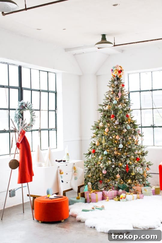 Martha Stewart's Holiday Crafting: Signature Tree Toppers & DIY Ornaments 19 A beautifully decorated Christmas nook with a tree, gifts, and stylish furniture