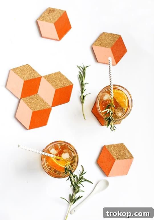 Geometric cork coasters arranged on a table with a plant