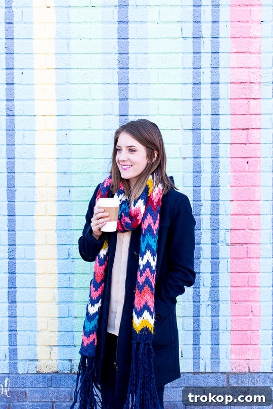 Wild, Wonderful Thanksgiving: Our West Virginia Escape 14 Ashley Rose posing in a vibrant urban setting, showcasing her stylish fall/winter attire