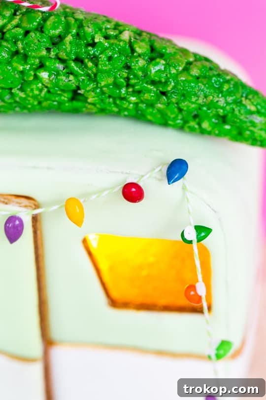 Gingerbread camper displayed on a white lacquer tray