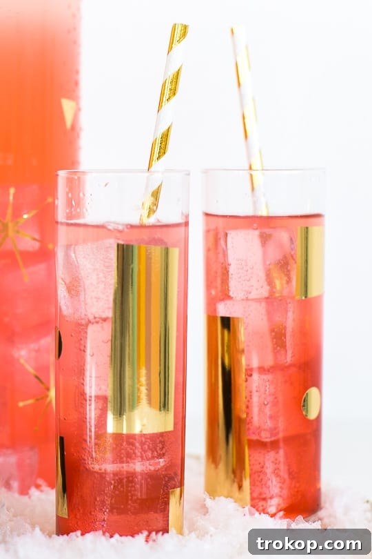 Close-up of DIY metallic patterned glassware, showcasing gold vinyl patterns on clear glass.