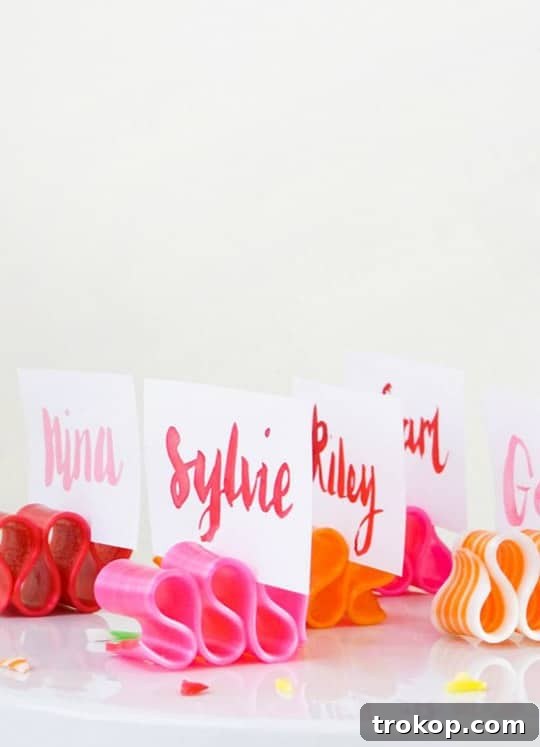Handmade Watercolor Ribbon Candy Place Settings 7 Watercolor lettering drying on candy ribbon place cards.