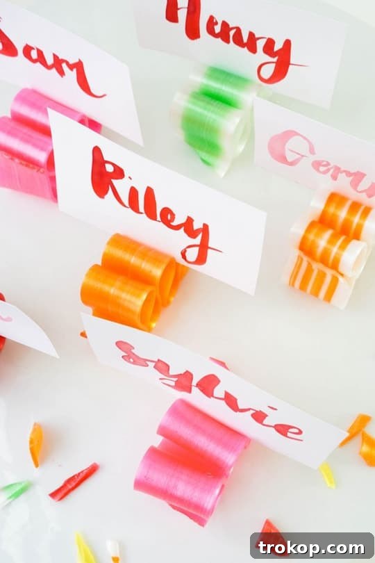 Handmade Watercolor Ribbon Candy Place Settings 10 Finished candy ribbon place card holders on a table.