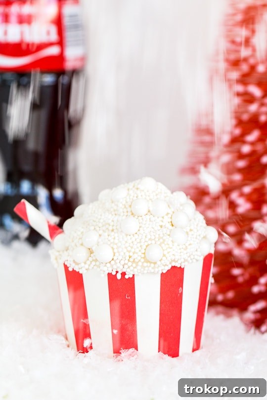 Old-Fashioned Coca-Cola Cupcakes 2 Delicious Classic Coca-Cola Cupcakes with fizzy icing and mini straw decoration