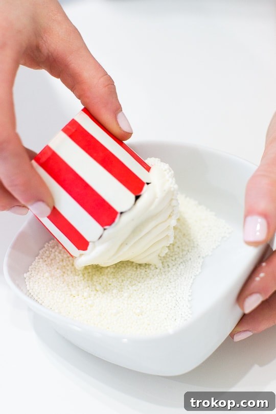 Old-Fashioned Coca-Cola Cupcakes 11 Freshly piped Fizzy Buttercream Icing on a Coca-Cola Cupcake