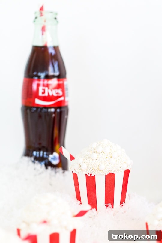 Old-Fashioned Coca-Cola Cupcakes 13 Two Classic Coca-Cola Cupcakes displayed together, showcasing their festive appeal