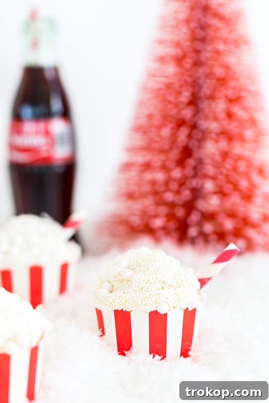 Old-Fashioned Coca-Cola Cupcakes 4 Rich chocolate Coca-Cola cupcakes topped with creamy white icing and festive sprinkles