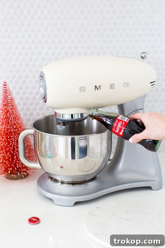 Old-Fashioned Coca-Cola Cupcakes 7 Combining wet ingredients in a bowl for Coca-Cola cupcake batter