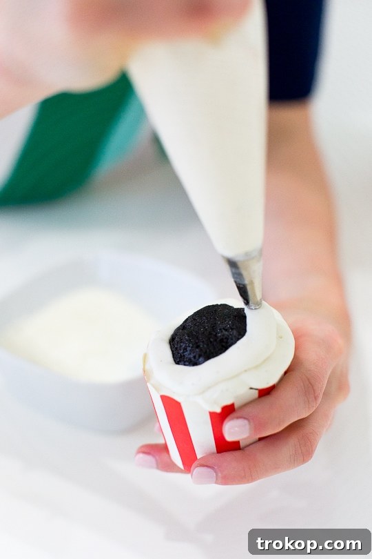 Freshly baked Coca-Cola cupcakes cooling on a wire rack