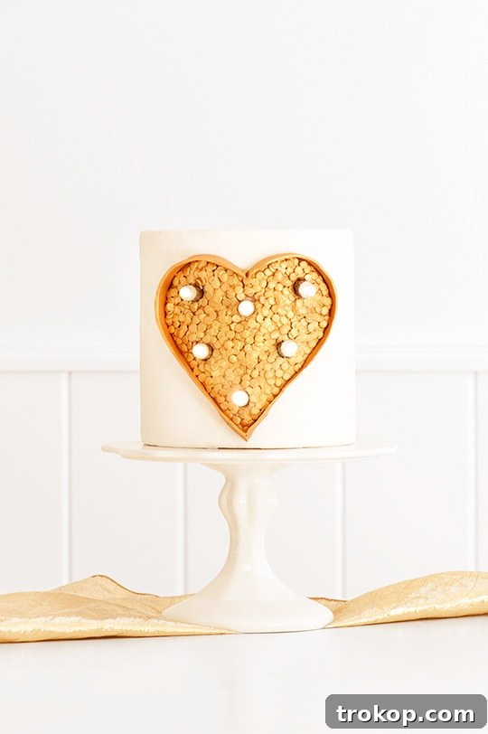 Stunning DIY Marquee Light Cake with sequin heart and LED lights for a celebration