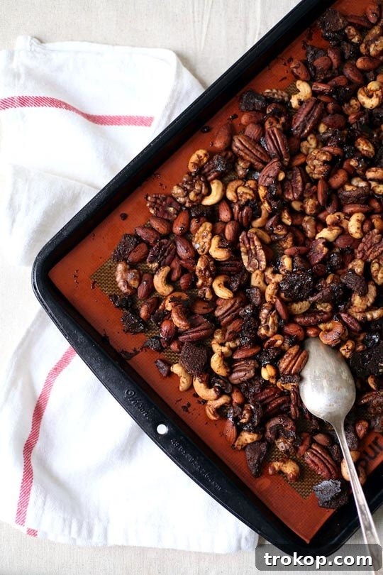 A bowl of freshly made Gingerbread Candied Nuts, ready to serve.