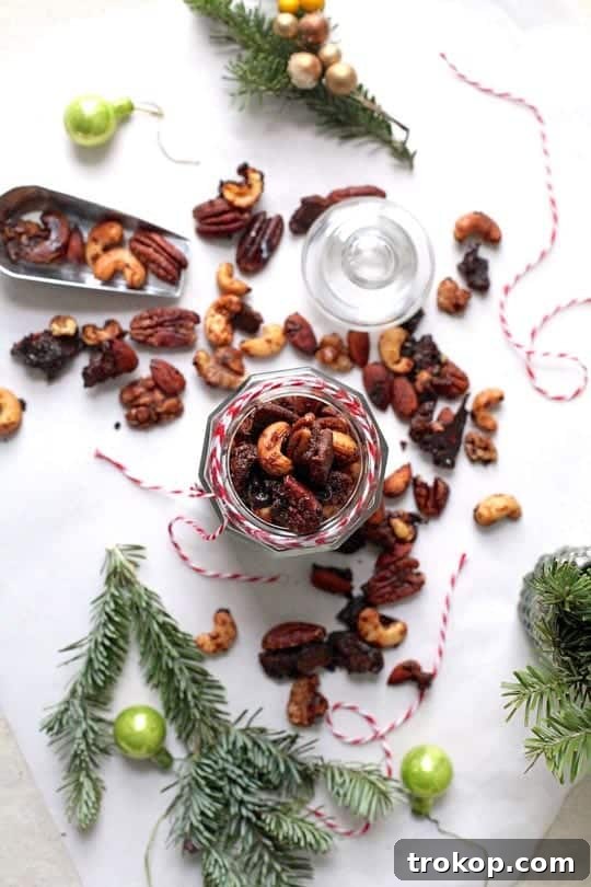 Pile of Gingerbread Candied Nuts with festive decor.