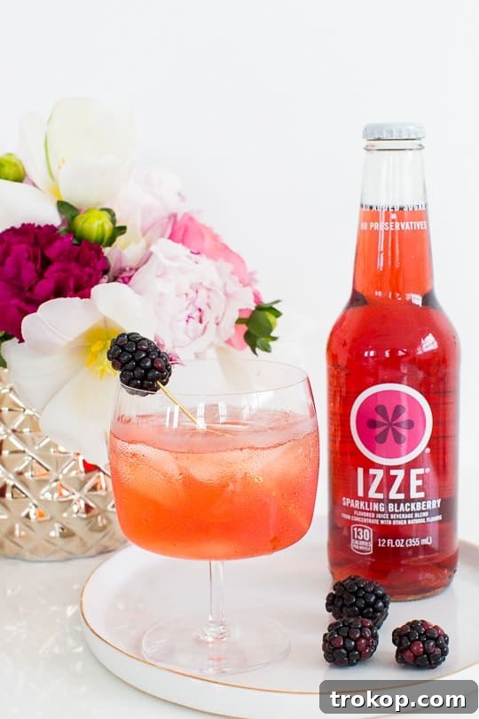 3-Ingredient Blackberry Champagne Fizz 11 Large punch bowl with Blackberry Champagne Punch and glasses