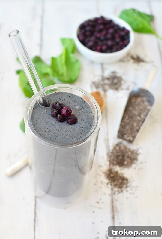 Cleanse & Recharge: Dairy-Free Green Detox Smoothie 7 Pouring detox green smoothie into glass