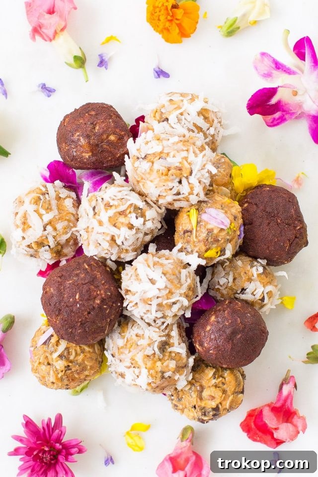 Close-up of a peanut butter energy ball garnished with edible flowers and chocolate chips
