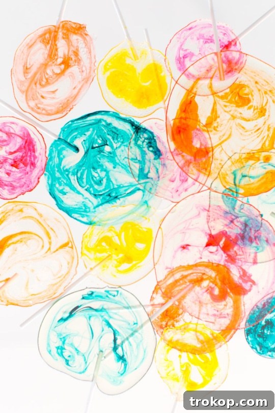 DIY Marble Spiked Lollipops by Sugar & Cloth Top Houston Lifestyle Blogger Ashley Rose #lollipops #diy #recipe #marble #spiked #tequila #alcohol #adult #candy #sweets