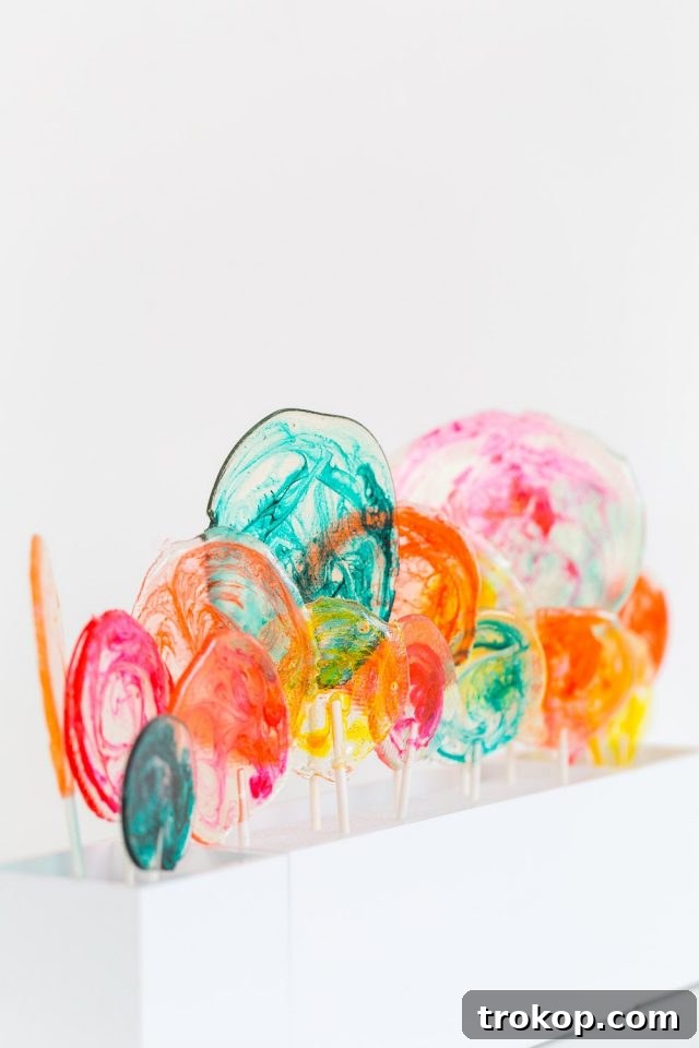 DIY Marble Spiked Lollipops by Sugar & Cloth Top Houston Lifestyle Blogger Ashley Rose #lollipops #diy #recipe #marble #spiked #tequila #alcohol #adult #candy #sweets