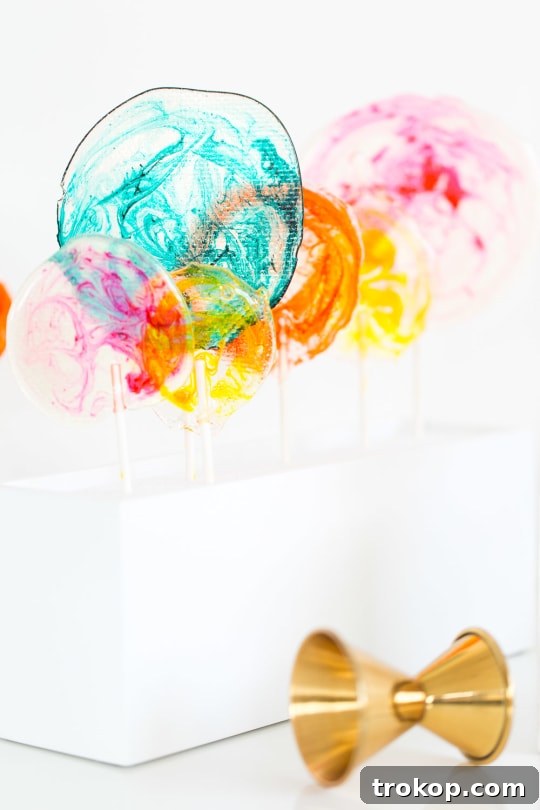 DIY Marble Spiked Lollipops by Sugar & Cloth Top Houston Lifestyle Blogger Ashley Rose #lollipops #diy #recipe #marble #spiked #tequila #alcohol #adult #candy #sweets