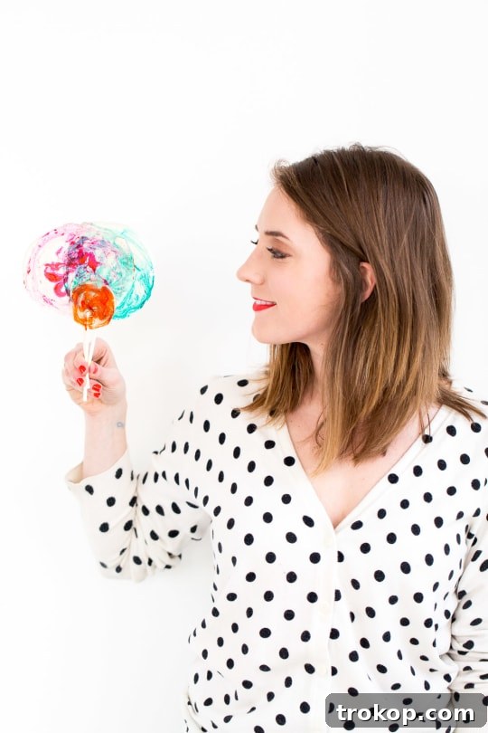 DIY Marble Spiked Lollipops by Sugar & Cloth Top Houston Lifestyle Blogger Ashley Rose #lollipops #diy #recipe #marble #spiked #tequila #alcohol #adult #candy #sweets