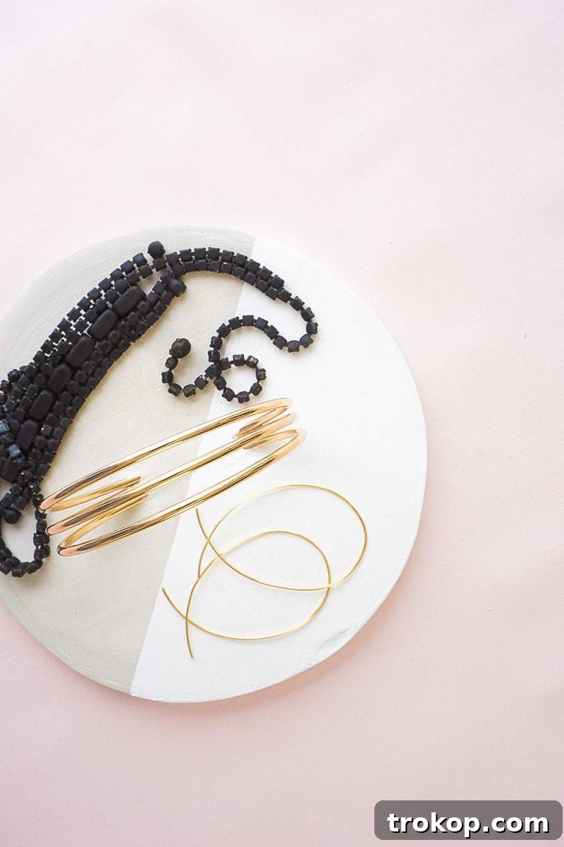 Overhead view of a styled DIY concrete tray with macarons, showcasing its elegance