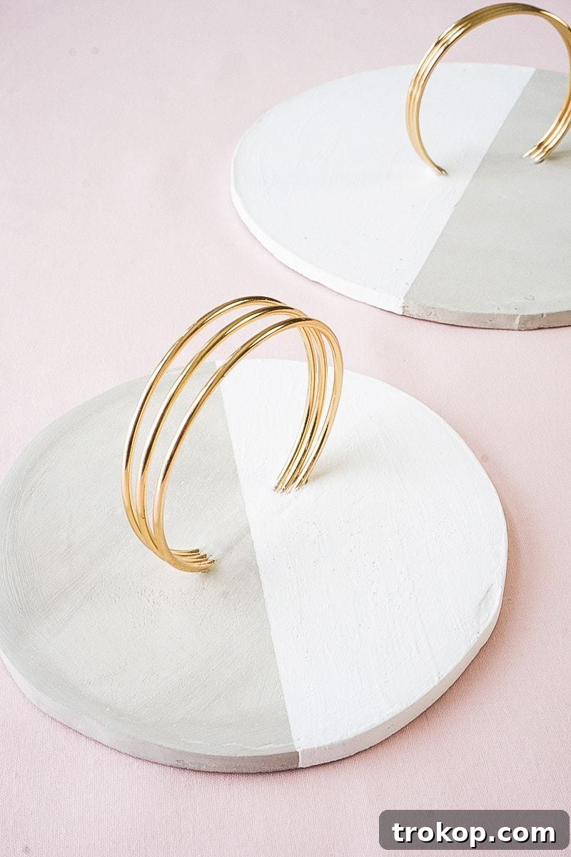 Another view of the DIY concrete tray, showcasing its elegant form and the contrast between concrete and brass