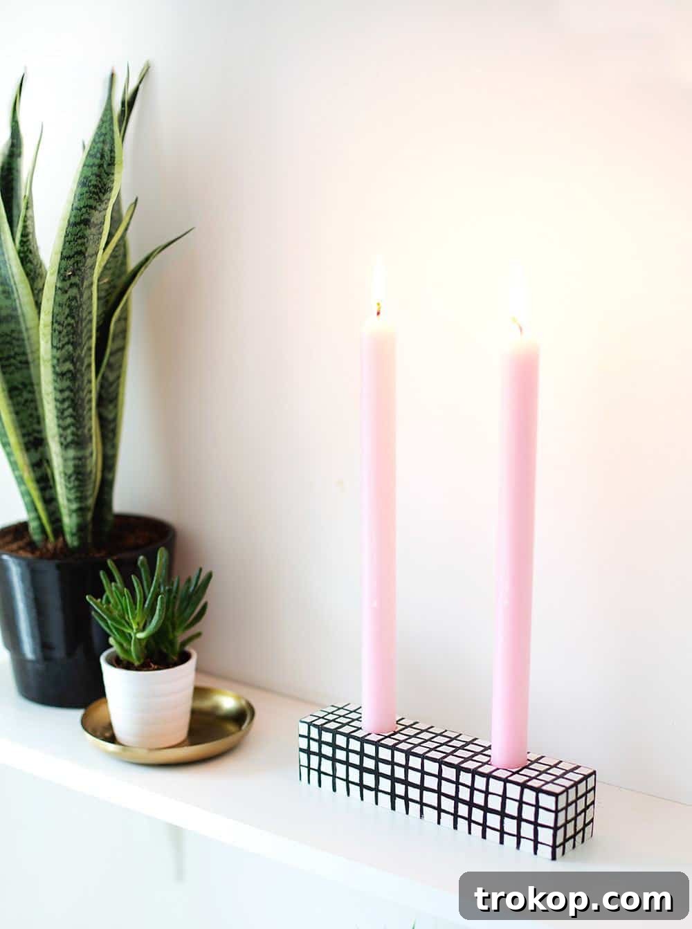 Handmade Patterned Candle Decor 11 A patterned DIY candle holder with two pink candles, set on a plain background, ready for display as a decorative item.