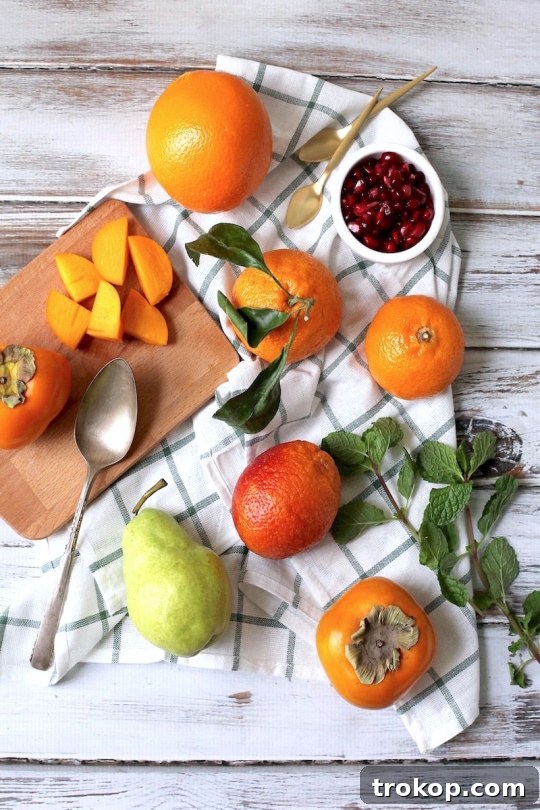 Close-up of fresh citrus and winter fruits for a healthy salad