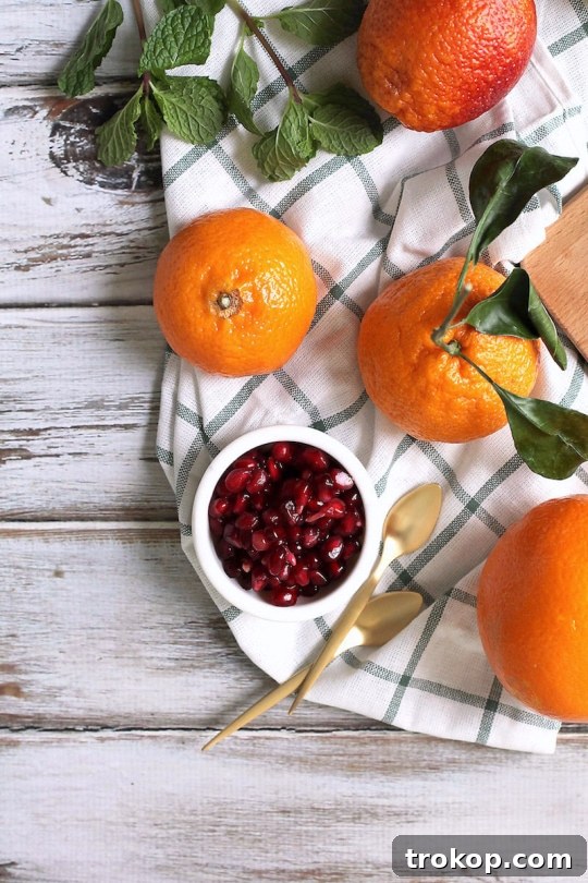 Freshly assembled winter fruit salad with citrus and pomegranate