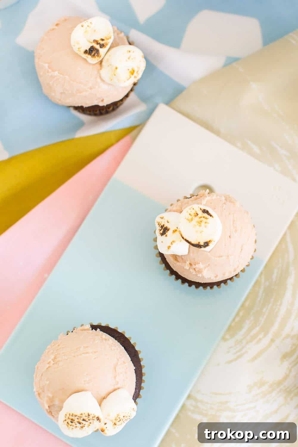 Close-up of a perfectly frosted Dunkin' Donuts Hot Chocolate Cupcake ready to be served.