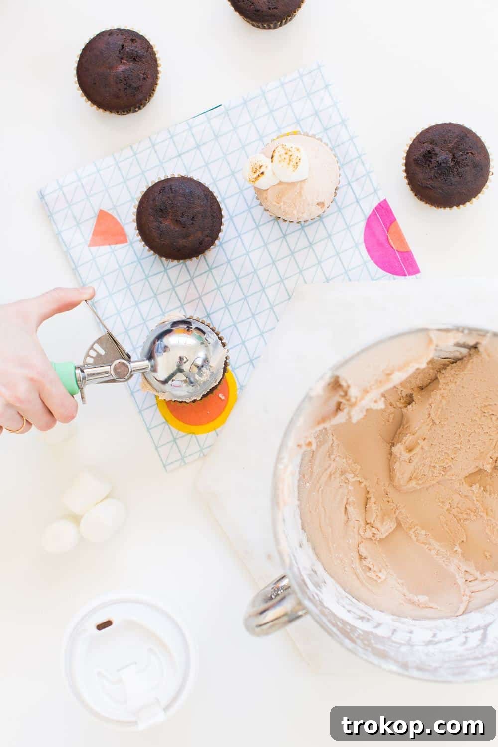 Step-by-step imagery showing butter, sugar, and hot chocolate mix being blended into a smooth frosting.