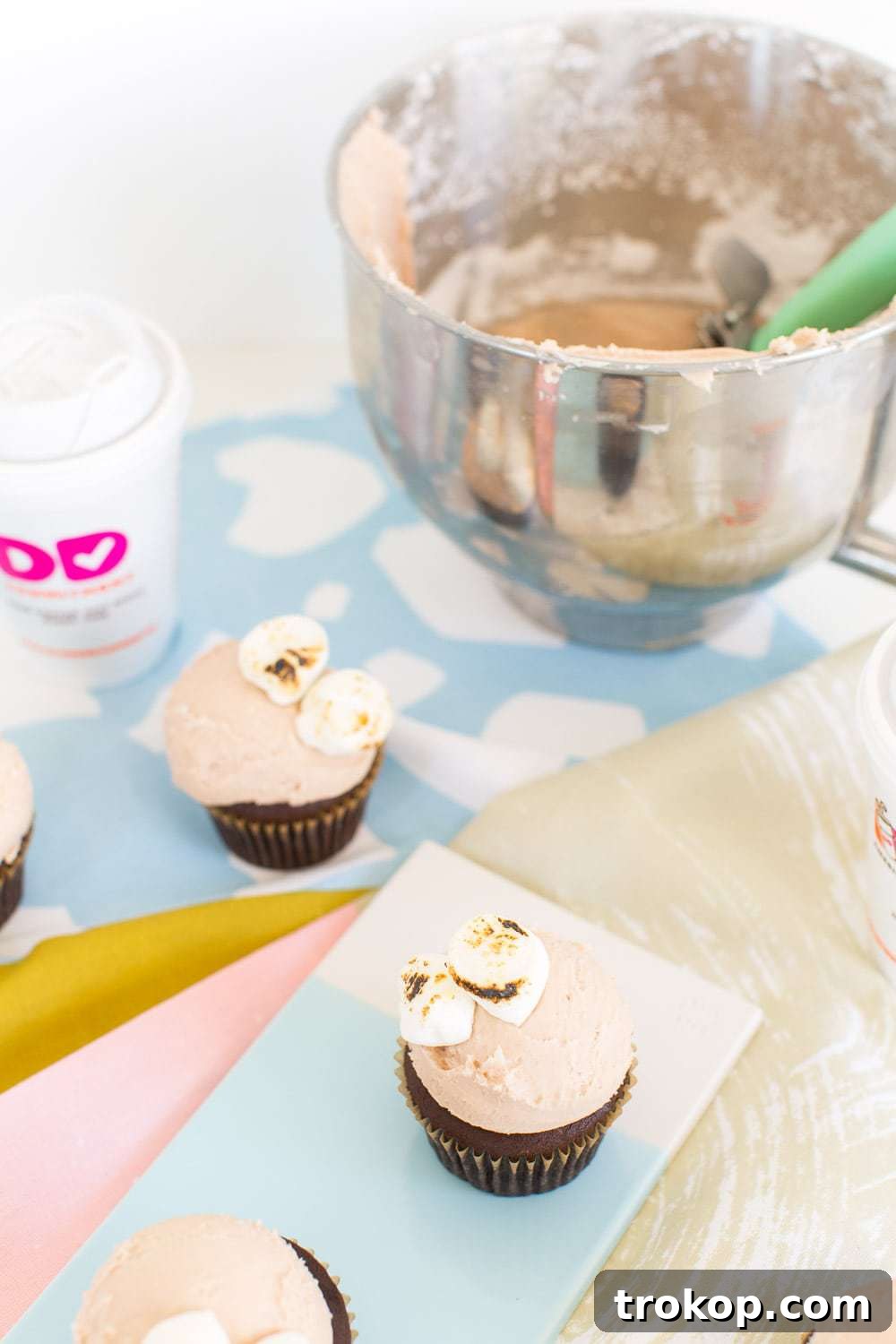 Finished Dunkin' Donuts Hot Chocolate Cupcakes with toasted marshmallows, viewed from above.