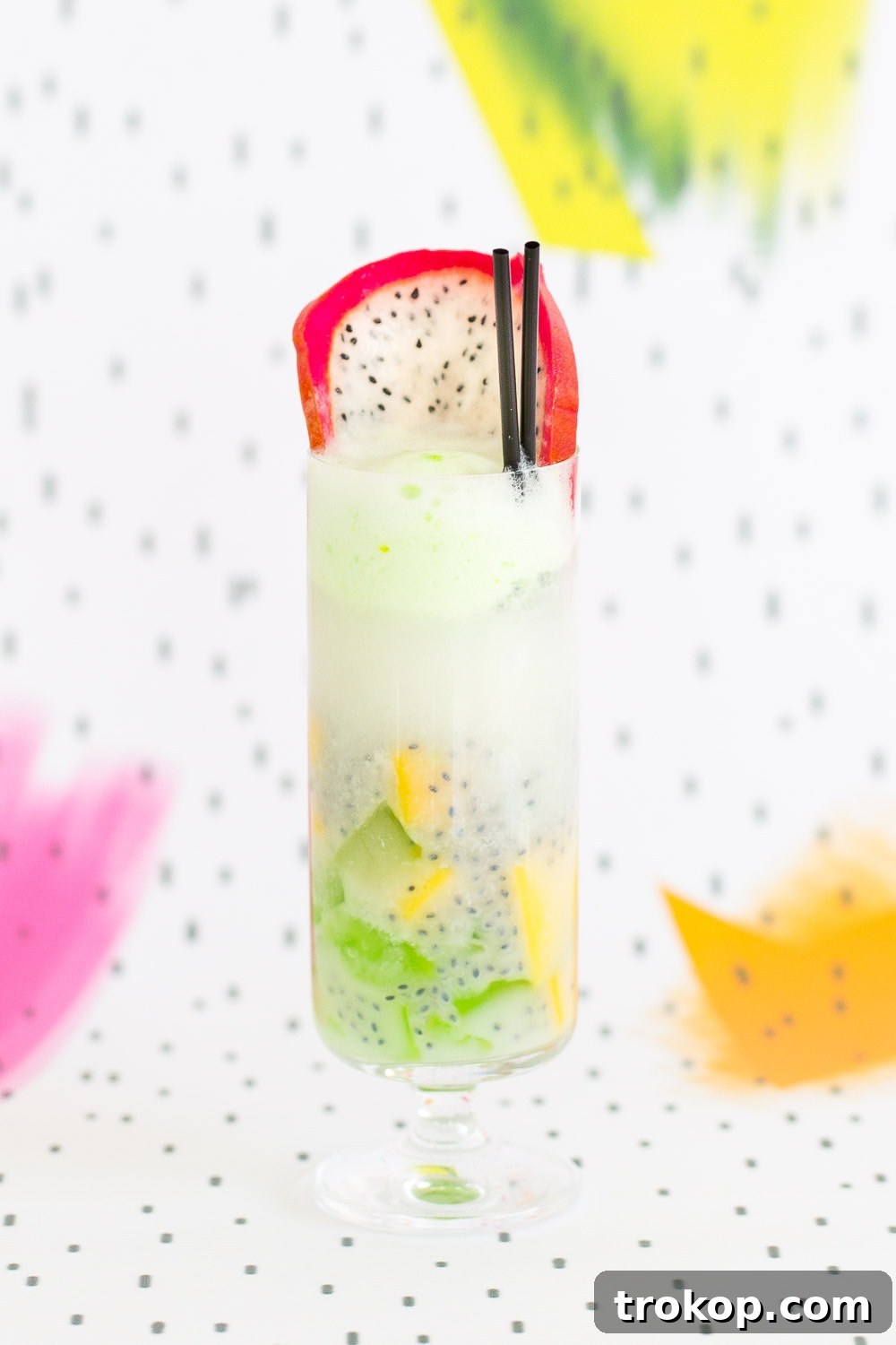 Tropical Thai Fruit Cocktail Recipe 3 Patter Play: Close-up of a refreshing Dotted Thai Fruit Cocktail with mango and basil seeds, set against a stylish, minimalist patterned backdrop.