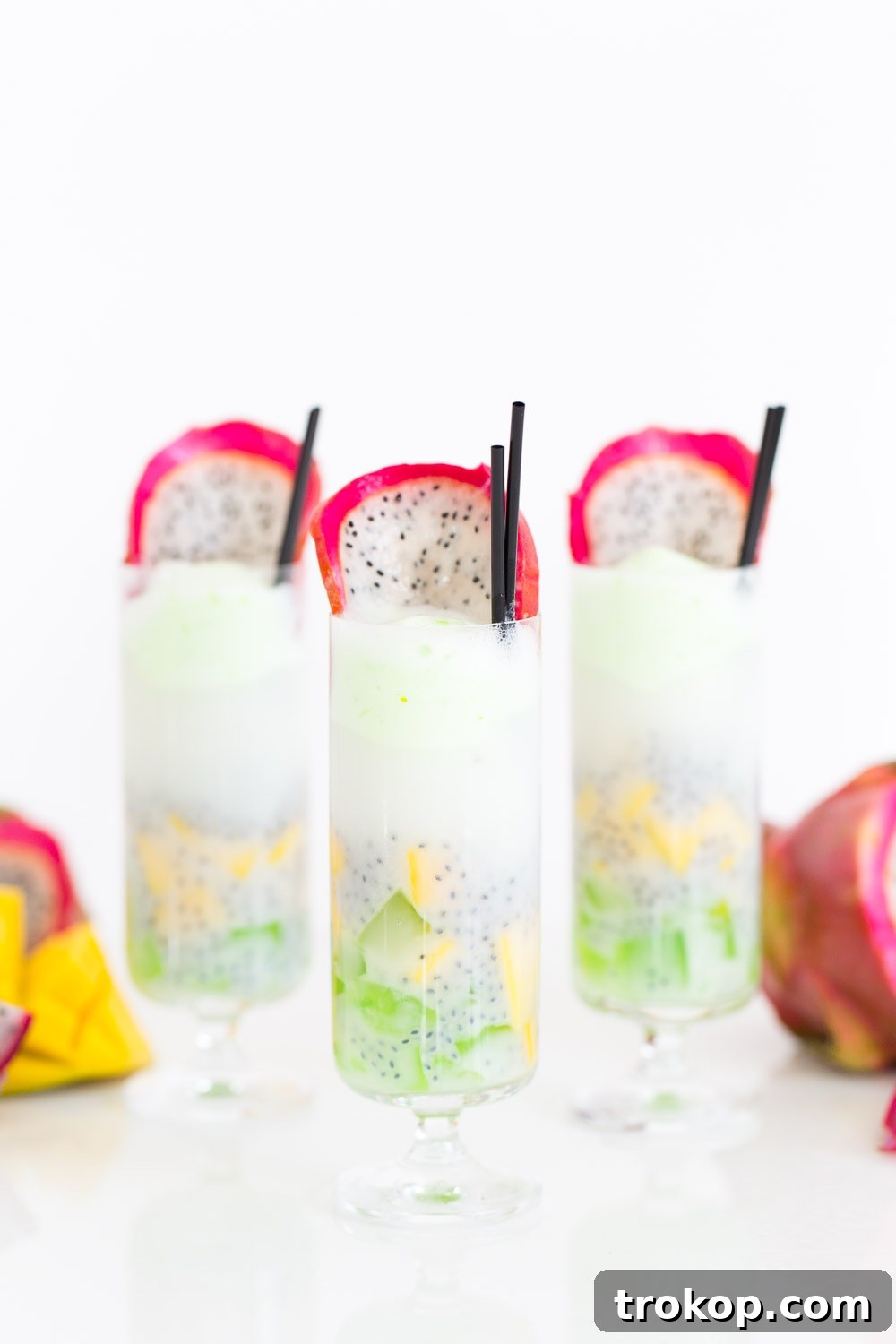 Tropical Thai Fruit Cocktail Recipe 7 Patter Play: A delightful close-up of the Dotted Thai Fruit Cocktail ingredients, emphasizing fresh mango, basil seeds, and colorful agar jelly for an exotic touch.