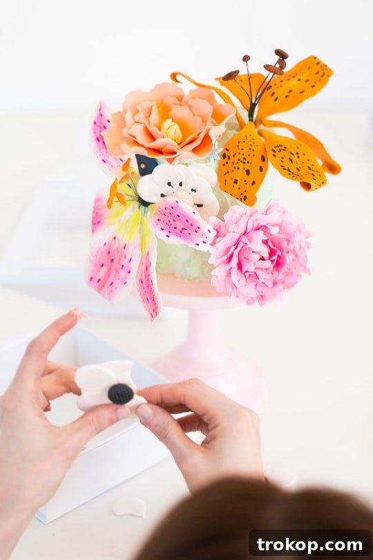 A beautifully completed DIY sugar flower cake, ready for display.
