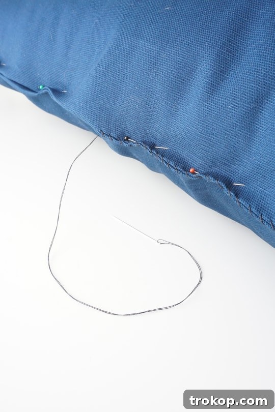 Image showing the pillow cover being stuffed with the pillow form