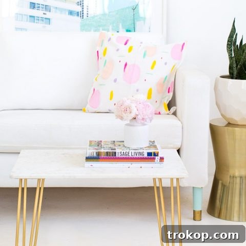 Detailed image of the finished DIY marble and gold side table, ready to be adorned with decor.