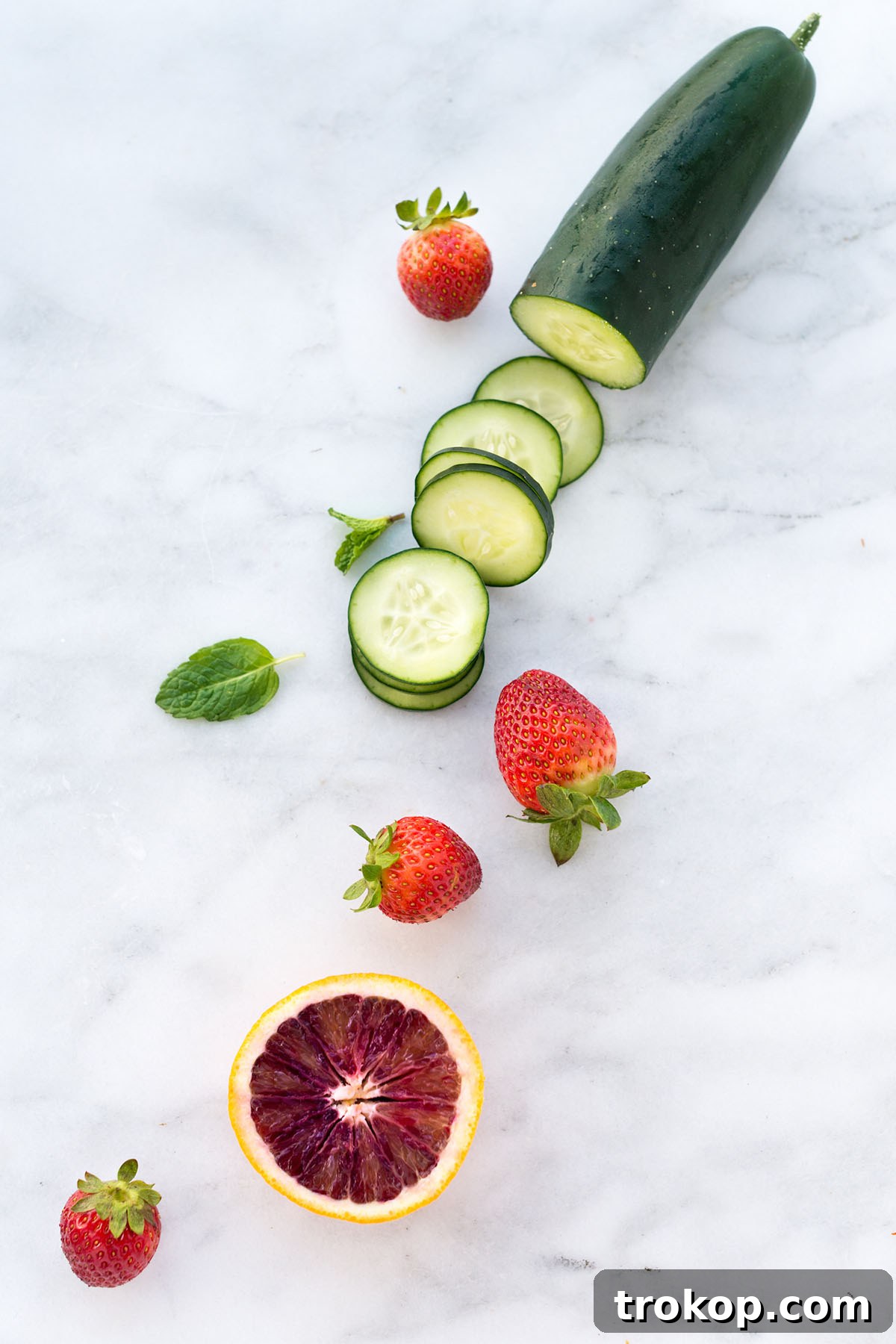 Summer Pimms Sparkler 3 Muddled strawberries and cucumber for Sparkling Pimm's Cup