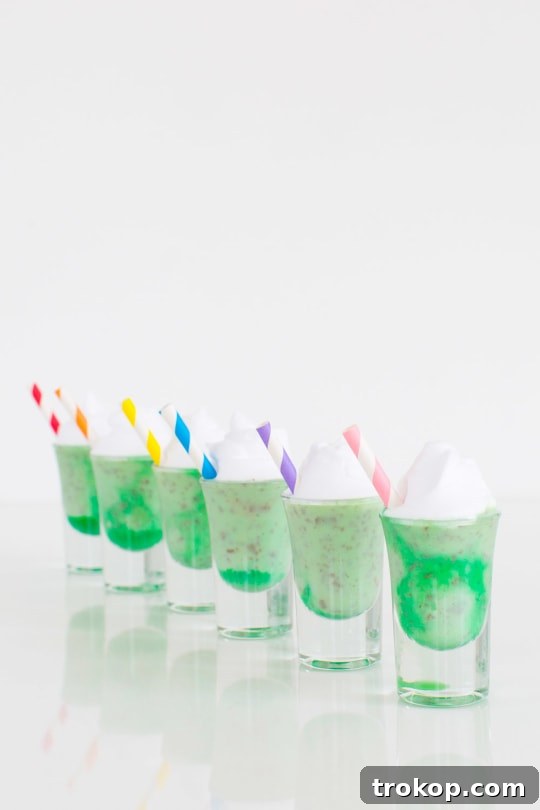 Marbled Creme de Menthe Ice Cream Shots for St. Patrick's Day with beautiful green and white swirls, garnished with chocolate shavings