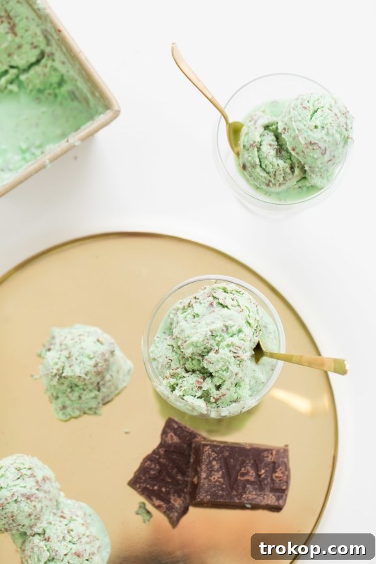 Crème de Menthe ice cream being scooped into shot glasses, ready for assembly into decadent dessert shots.