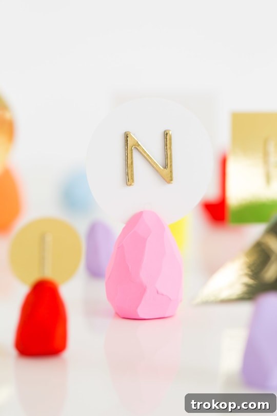 Close-up of a finished DIY faceted Easter egg place card holder on a decorative table setting.