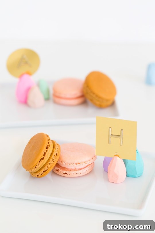 Easter table setting featuring DIY faceted place card holders and macarons.