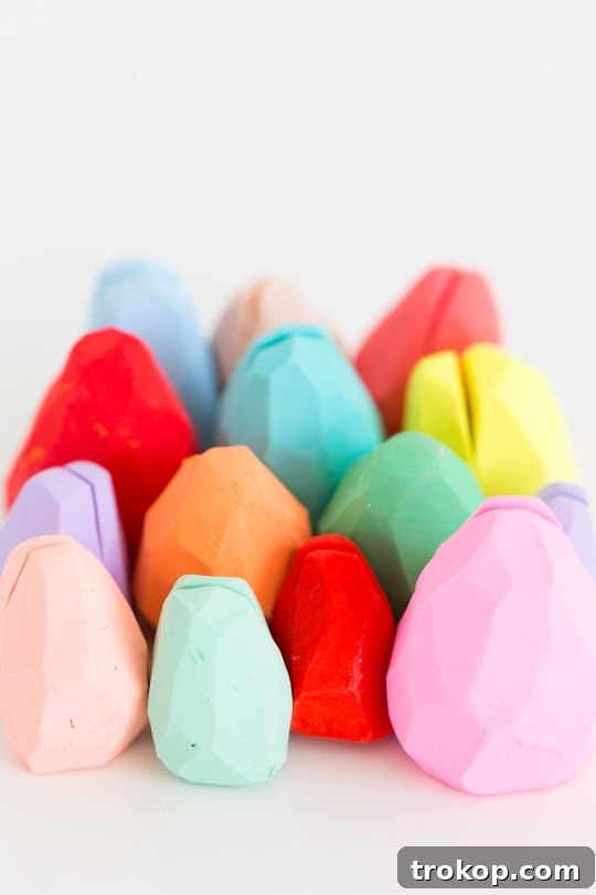A festive Easter table setting with DIY faceted egg place card holders and sweet treats.