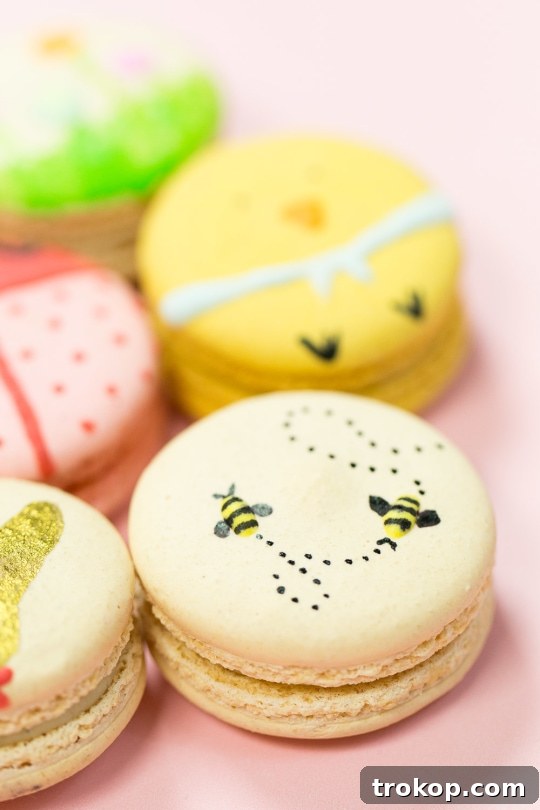 Lindt Gold Bunny inspired macaron with edible gold dust and painted red bow
