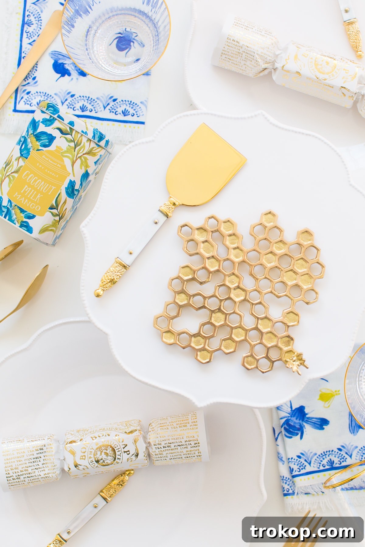 Vibrant Spring Tablescape featuring Anthropologie Lotus Dinnerware with bright white, colorful florals, and gold accents, perfect for elegant home entertaining.