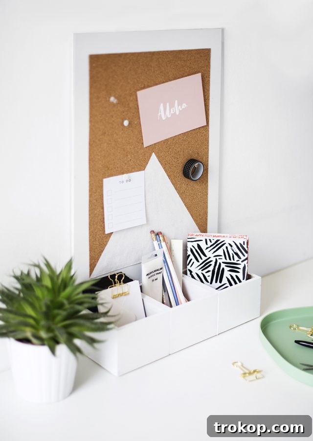 Craft Your Custom Desk Organizer 11 An inspiring view of a neatly organized desk featuring the DIY cork board organizer, brimming with pens, notes, and a succulent.