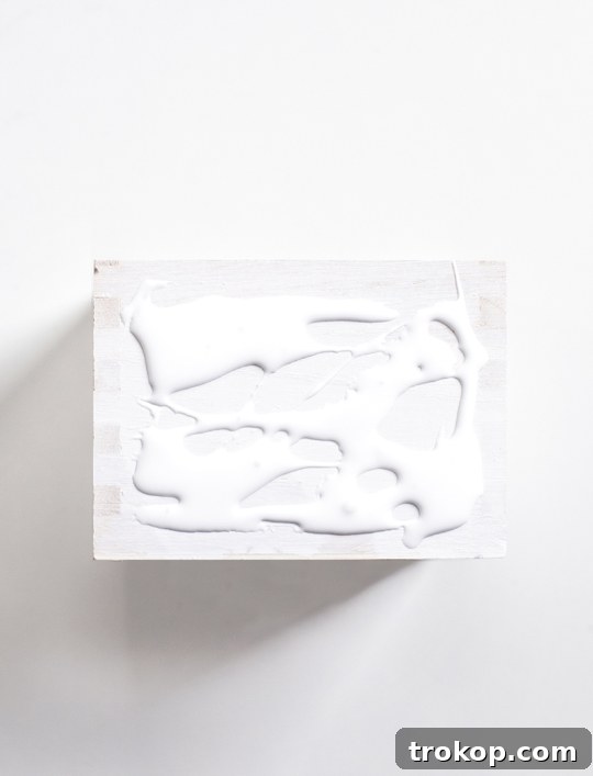Craft Your Custom Desk Organizer 5 First step in making a DIY desk organizer: spray painting the wood components white for a clean finish.